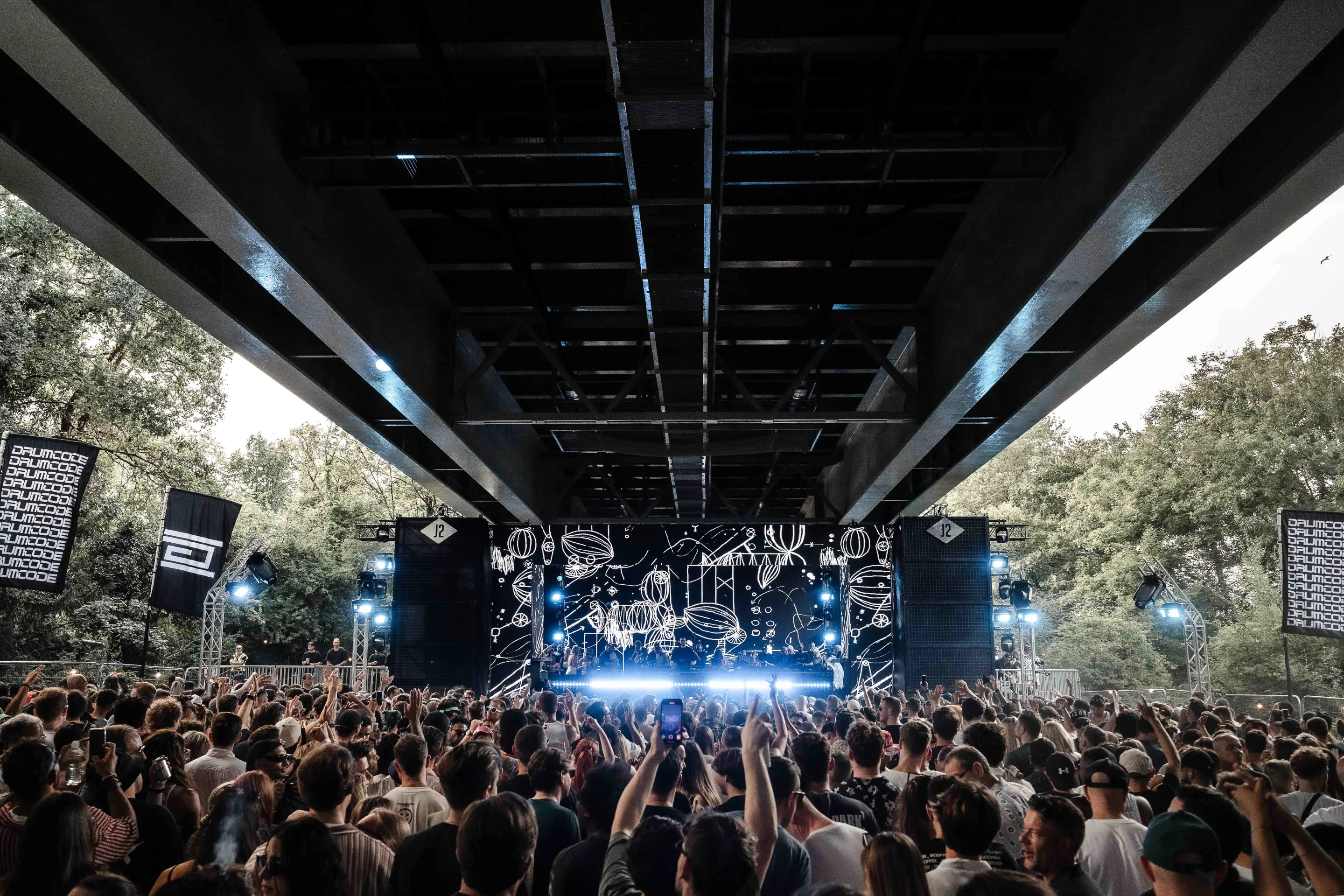 Live concert photography capturing musicians performing on stage with dynamic lighting and energetic crowd engagement.